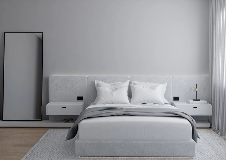 Quarto minimalista em tons cinzas.
